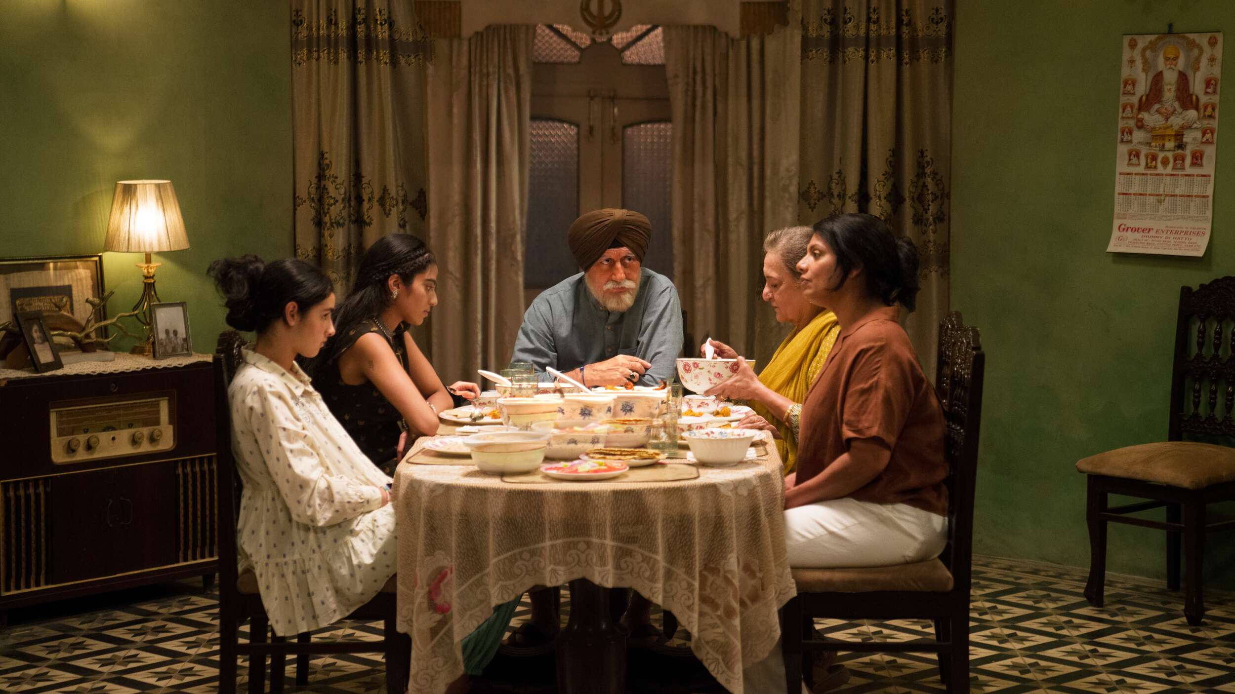 Calorie directed by Eisha Marjara Picture of Family at Dinner Table Production Still