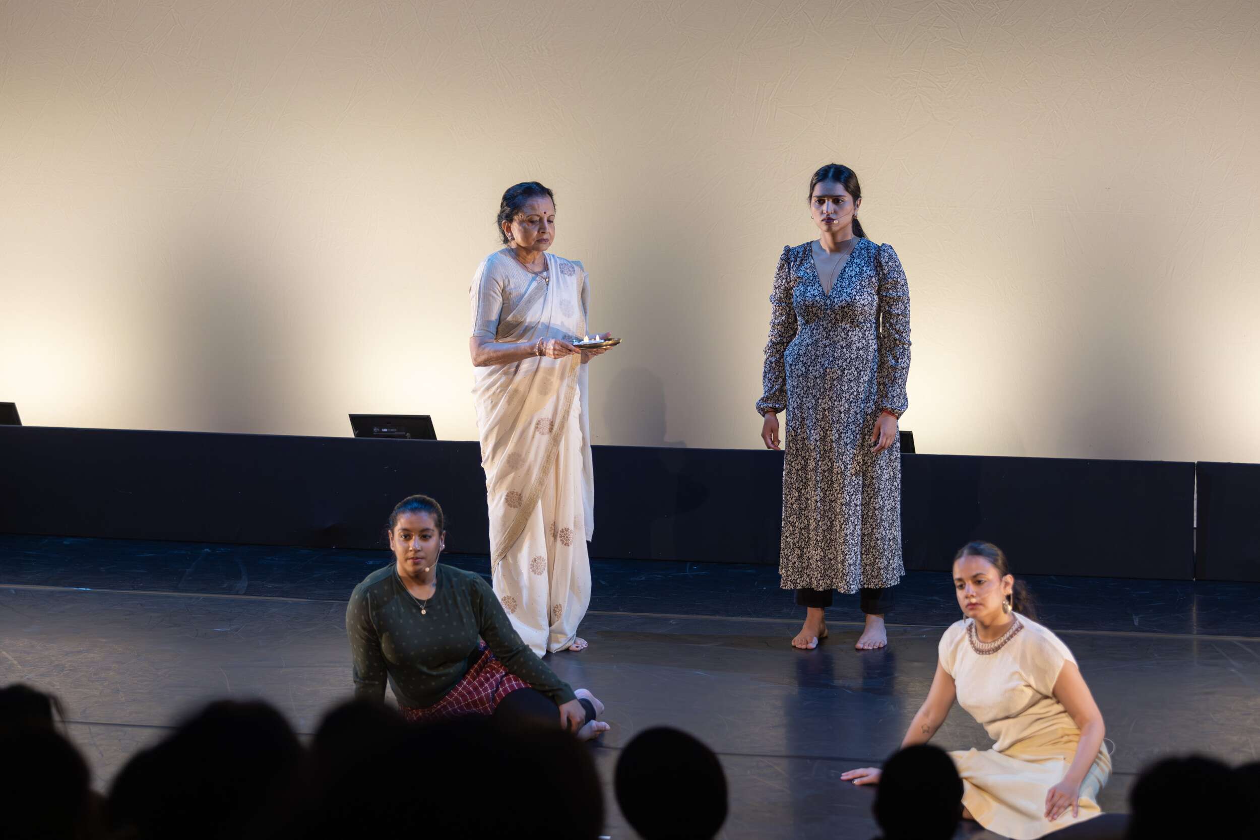 Lata Pada (top left) and dancers from Sampradaya Dance Creations perform a work co-directed by Suma Suresh and Lata Pada, honoring the 40th anniversary of the Air India Flight 182 tragedy.