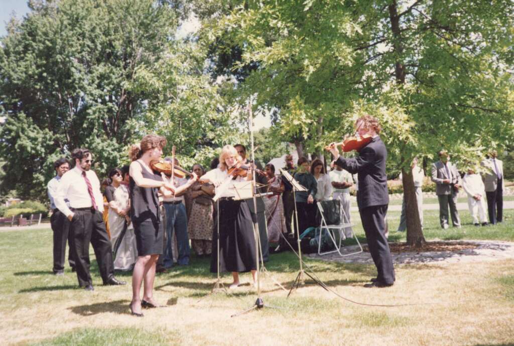 In memory of his daughters Rupa and Aruna, Dr. Anantaraman paid for violinists to play at an Ottawa Air India Memorial Ceremony; c. 1989-1991; photo by Sundaram (Ramu) Ramakesavan